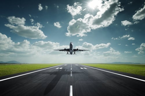 Aeroplane landing with sky clouds