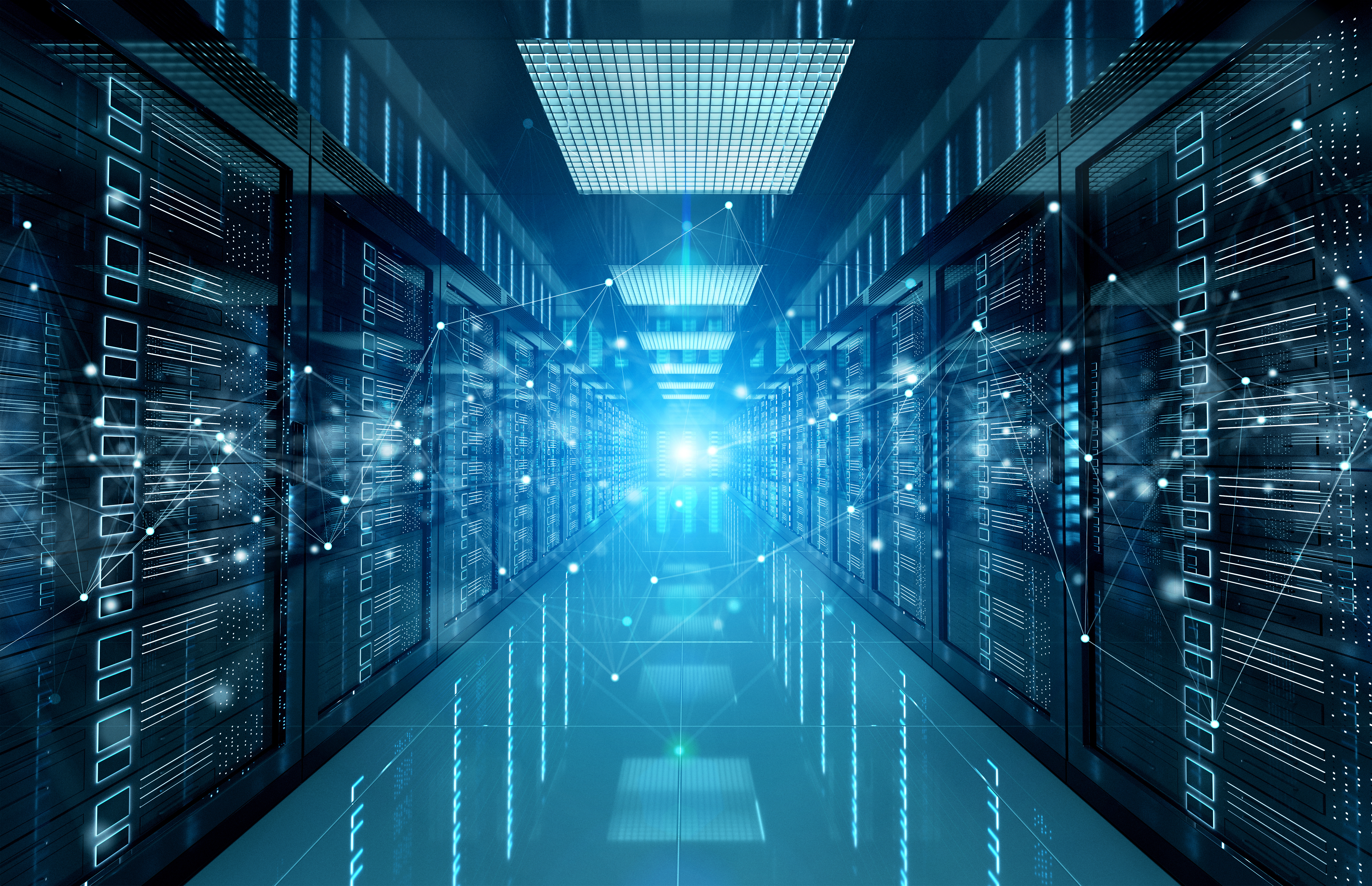 Bright futuristic server room with rows of illuminated racks and digital data connections, featuring a glowing light at the center.